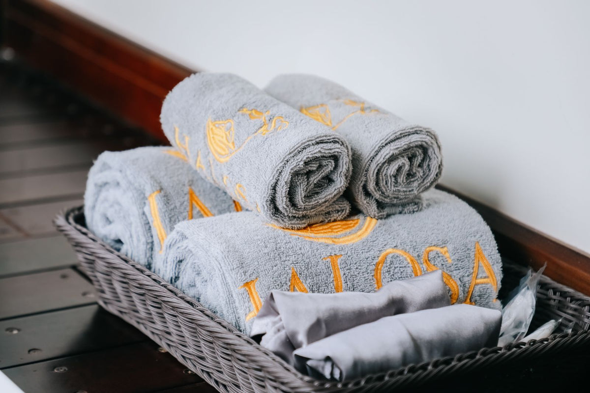 Rolled clean towels in a basket